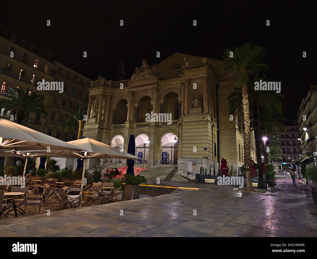 Night view of illuminated Toulon Opera building at the French Riviera with cafe seating in front on Place Victor Hugo in historic center. Stock Photo