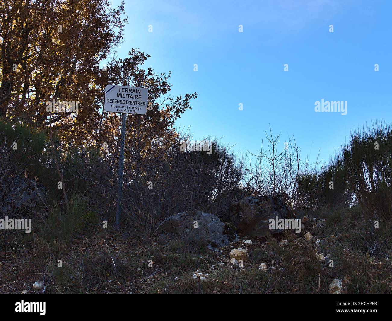 Warning sign at restricted zone near Camp de Canjuers, military training ground of the French Army (Armee de Terre), in Provence, France. Stock Photo