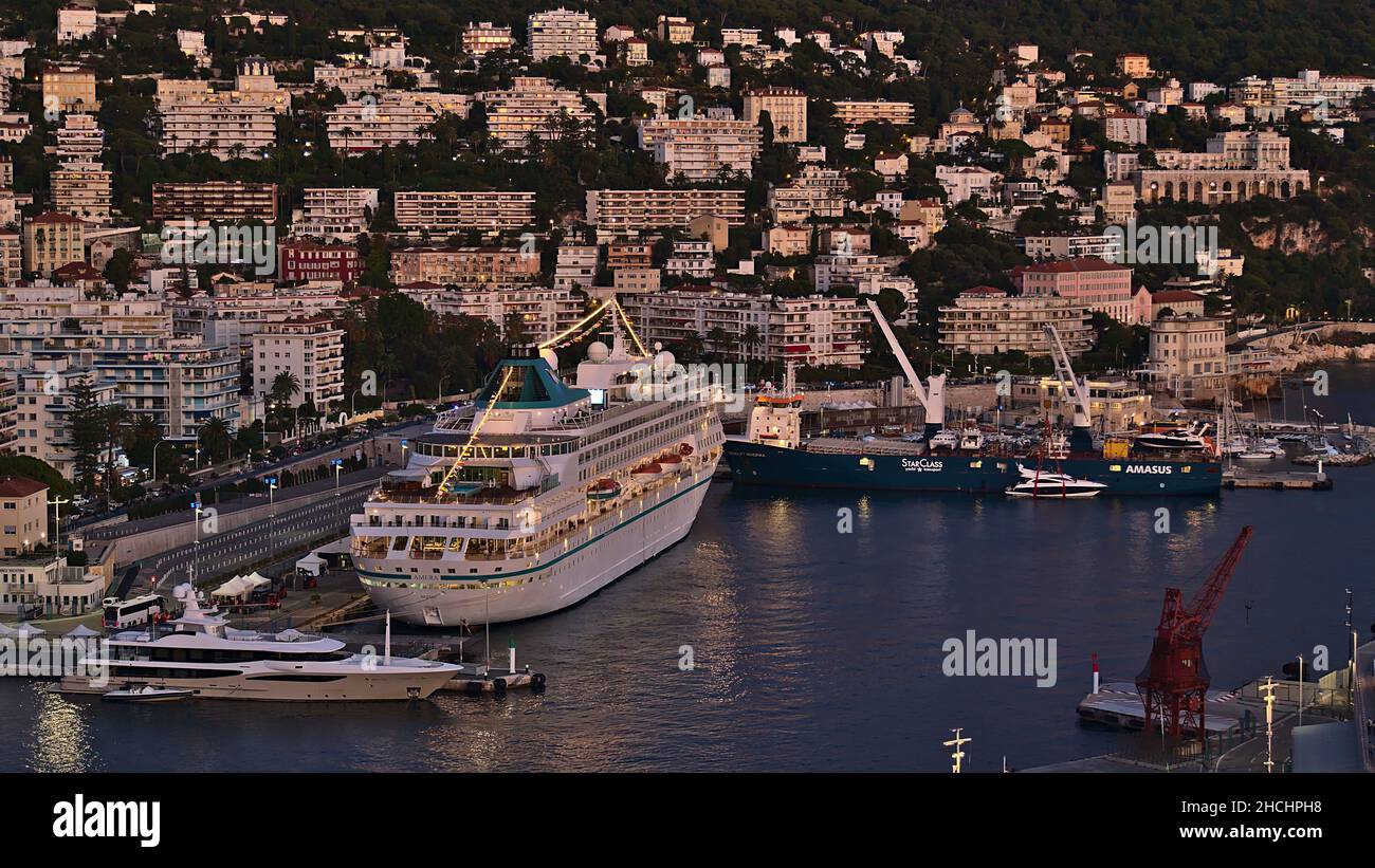 Aerial view of harbour Port Lympia with moored cruise ship MS Amera in Nice, France at the French Riviera in the evening light with buildings. Stock Photo