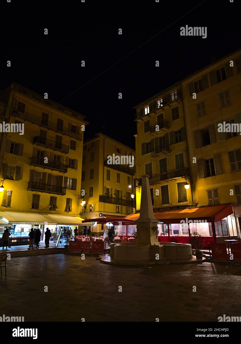 Night scene at square Place Rossetti in the historic center of city Nice, France at the French Riviera with illuminated old buildings and shops. Stock Photo