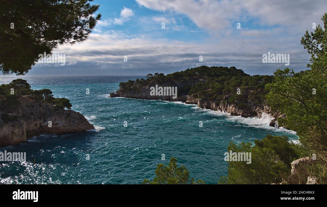 Panoramic view over popular bay Calanque de Port-Miou near Cassis at the French Riviera in Calanques National Park with rocks covered by green trees. Stock Photo
