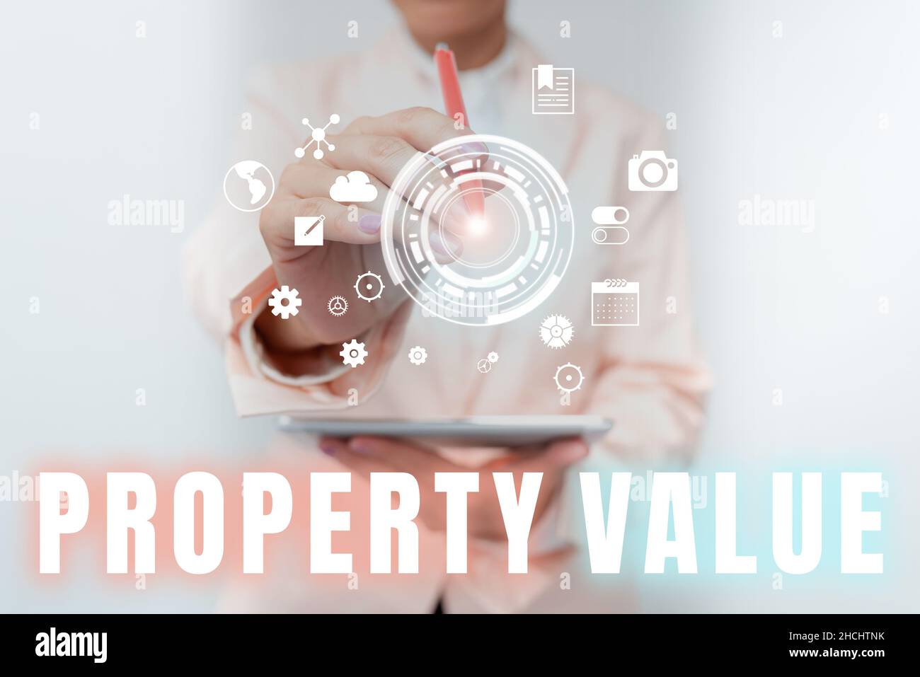 Hand writing sign Property Value. Word for Worth of a land Real estate appraisal Fair market price Business Woman Touching Digital Data On Holographic Stock Photo