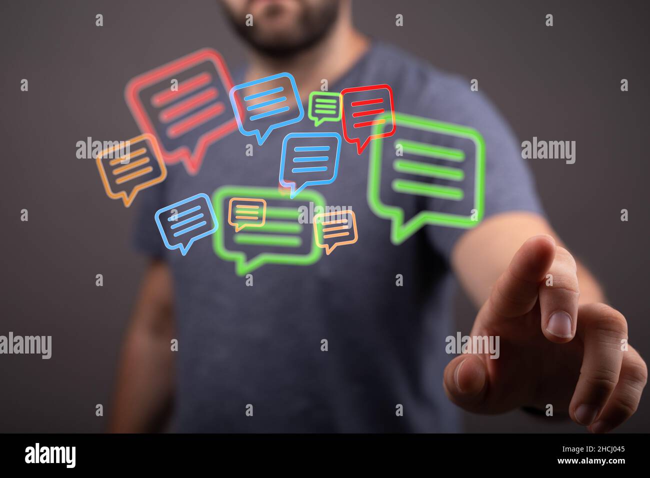 Message icons in front of a person Stock Photo - Alamy