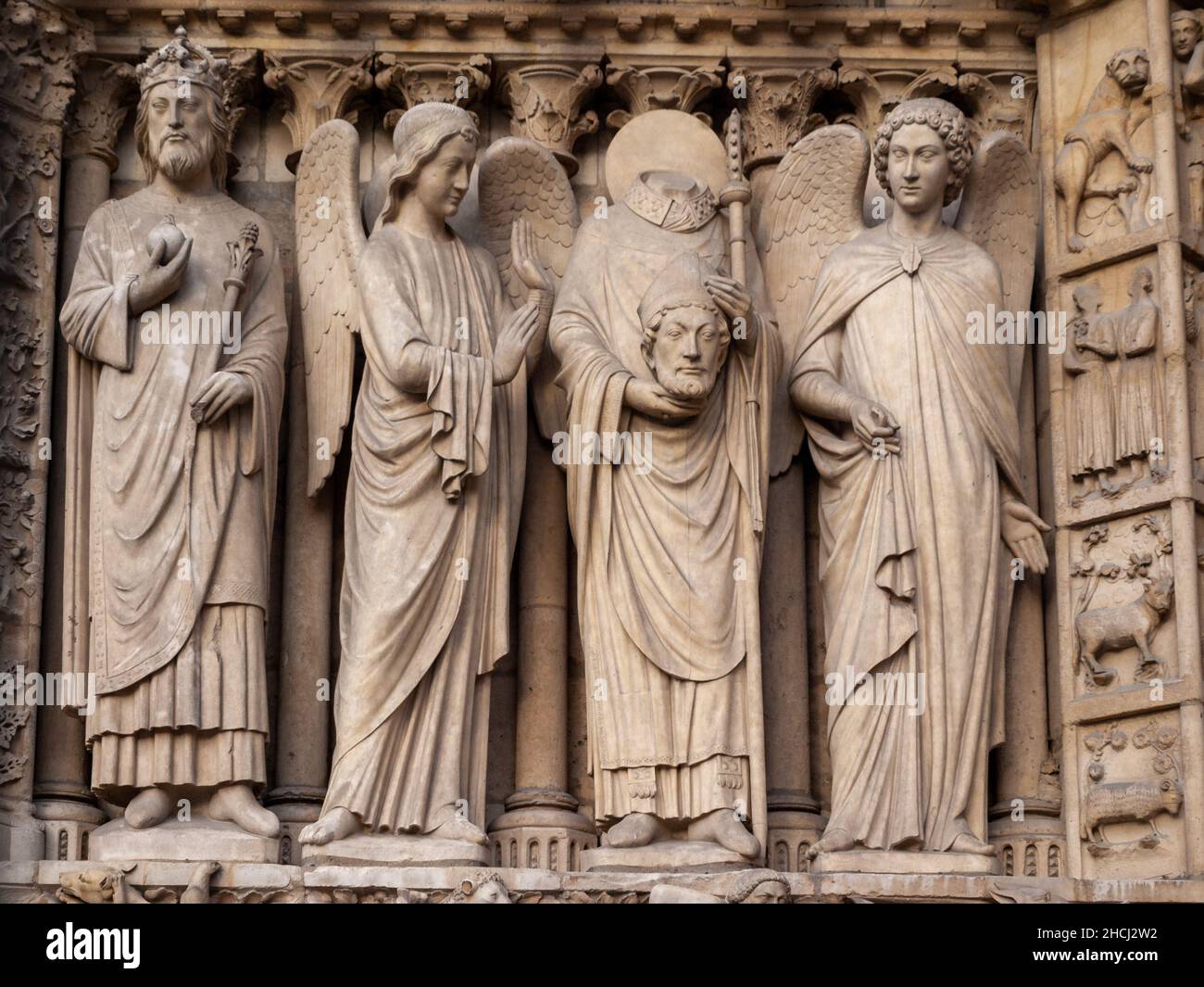Saint Denis martyr holding his head, with angles on his side, over the