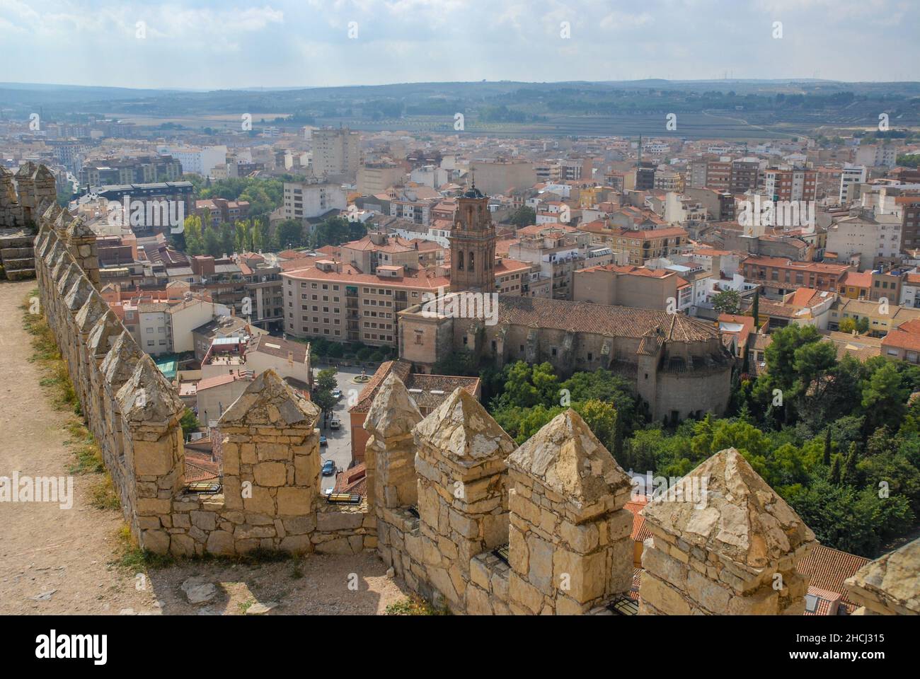 Almansa, Albacete, Spain - view from castle ramparts  to church and city buildings, with plains in the distance. Stock Photo