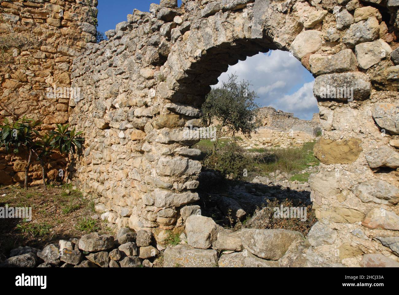 Arch in wall of abandoned Moorish village of L'Atzuvieta, near Alcala de La Jovada in the Vall d'Alcala, Alicante Province, Spain Stock Photo