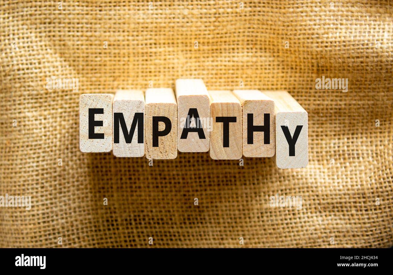 Empathy symbol. The concept word Empathy on wooden blocks. Beautiful ...