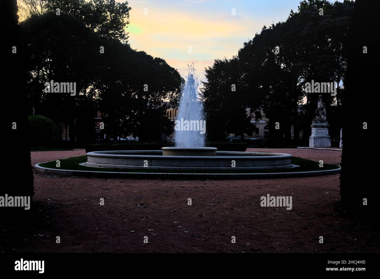 Fountain in a park at dusk Stock Photo Alamy