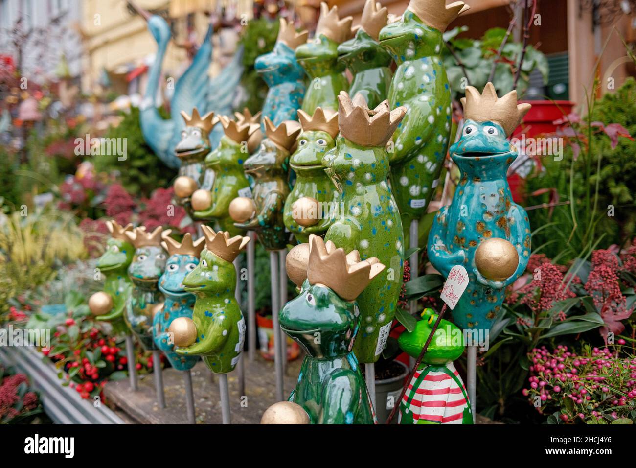 A closeup shot of ceramic figurines and decorations in an outdoor market Stock Photo