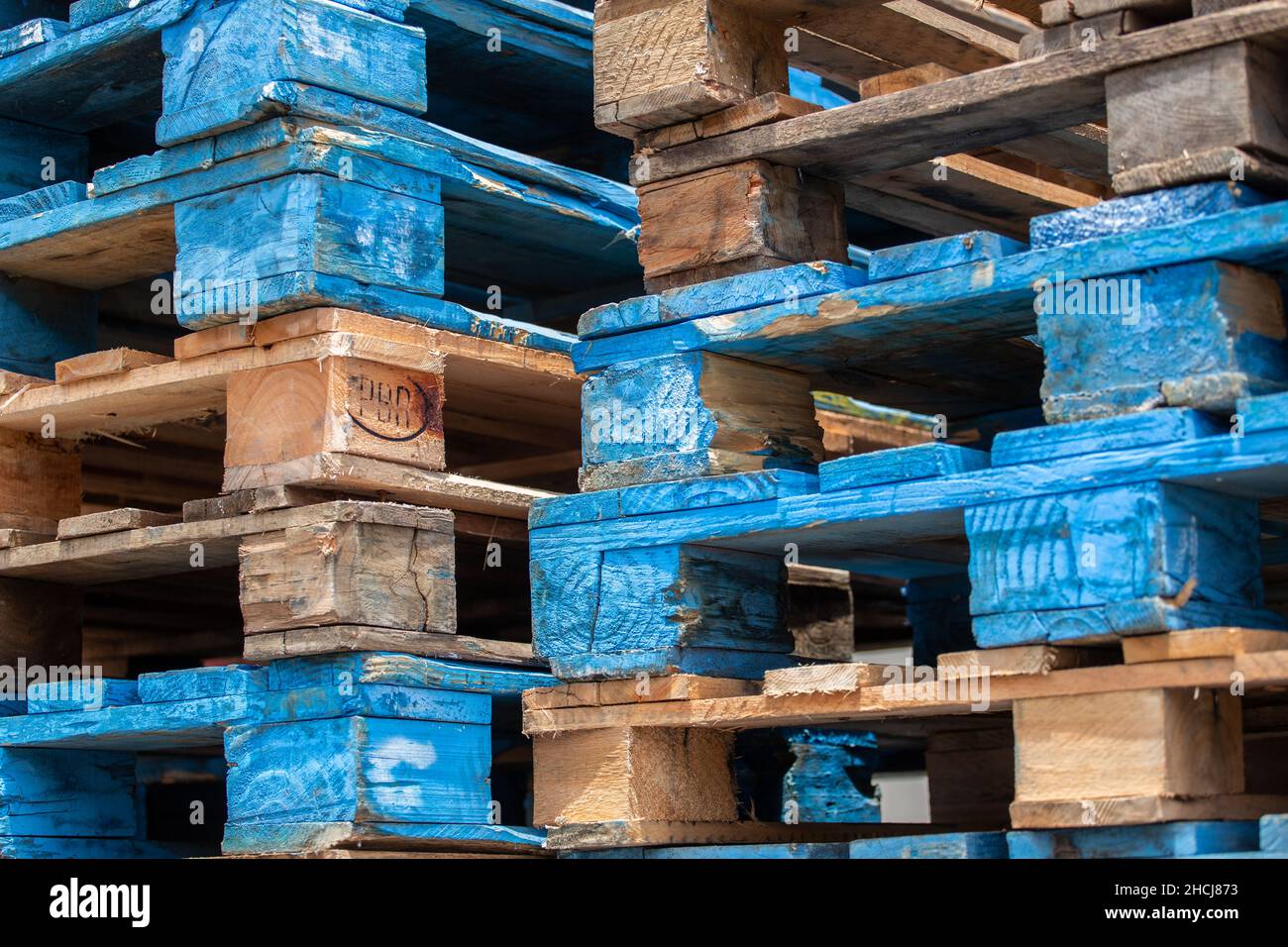 Closeup shot of wooden shipping pallets stacked on top of one another