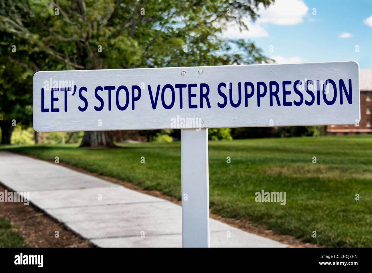 Voter Suppression sign with a pathway. Stock Photo