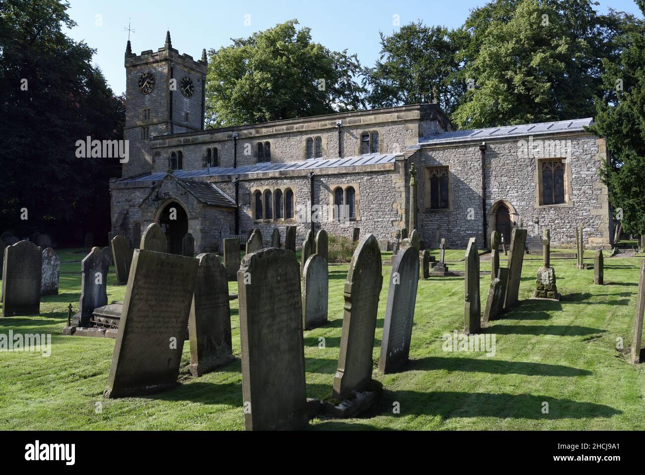 St Giles church graveyard in Great Longstone in the Derbyshire Peak District National Park, England UK English rural village churchyard graves Stock Photo