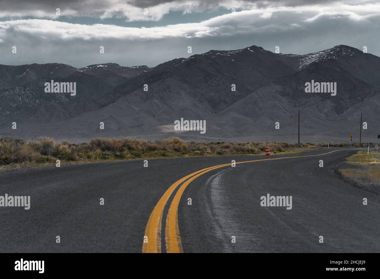 Empty asphalt road in a mountain landscape on a gloomy day Stock Photo ...
