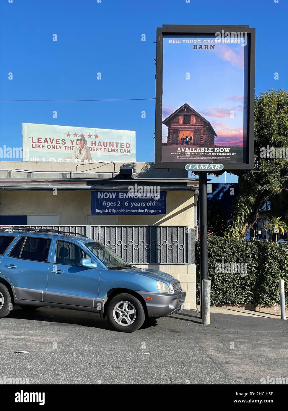 Posted billboard promoting a new release by recording artist Neil Young titled Barn on street in Los Angeles, CA Stock Photo