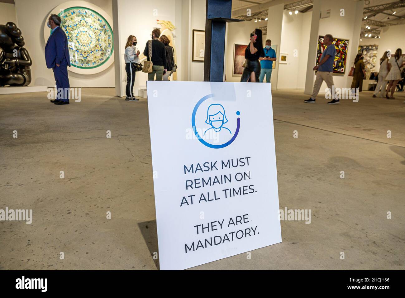 Miami Florida Art Basel Week CONTEXT Art Miami show shows sign notice face mask masks mandatory remain on Stock Photo