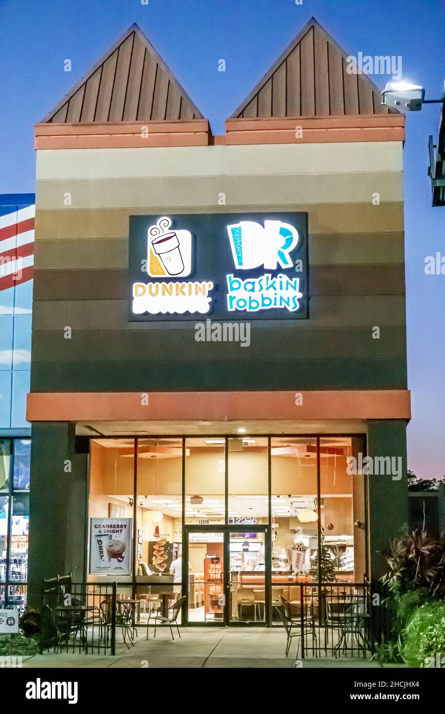 Orlando Florida South Apopka Vineland Road night nighttime Dunkin' Donuts Baskin Robbins outside exterior entrance Stock Photo