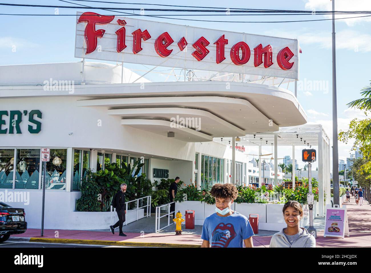 Miami Beach Florida Alton Road former Firestone Tire Tires store dealer giant neon sign renovated converted restaurant Stock Photo