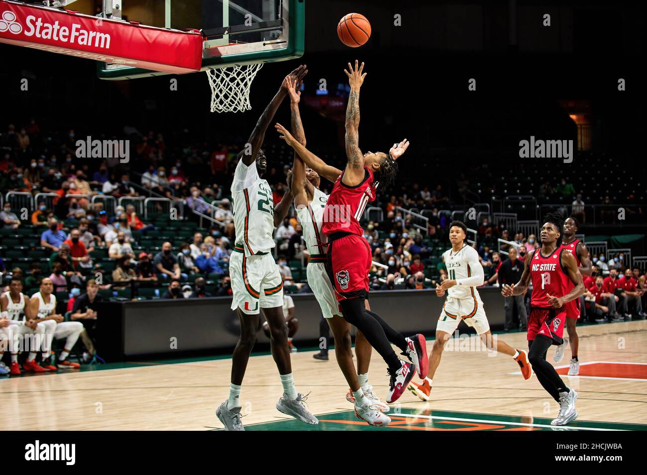 Coral Gables, Florida, USA. 29th Dec. 2021. 10 Breon Pass  during the Men’s Basketball between Miami Hurricanes vs NC State in Watsco Center. Credit: Yaroslav Sabitov/YES Market Media/Alamy Live News Stock Photo