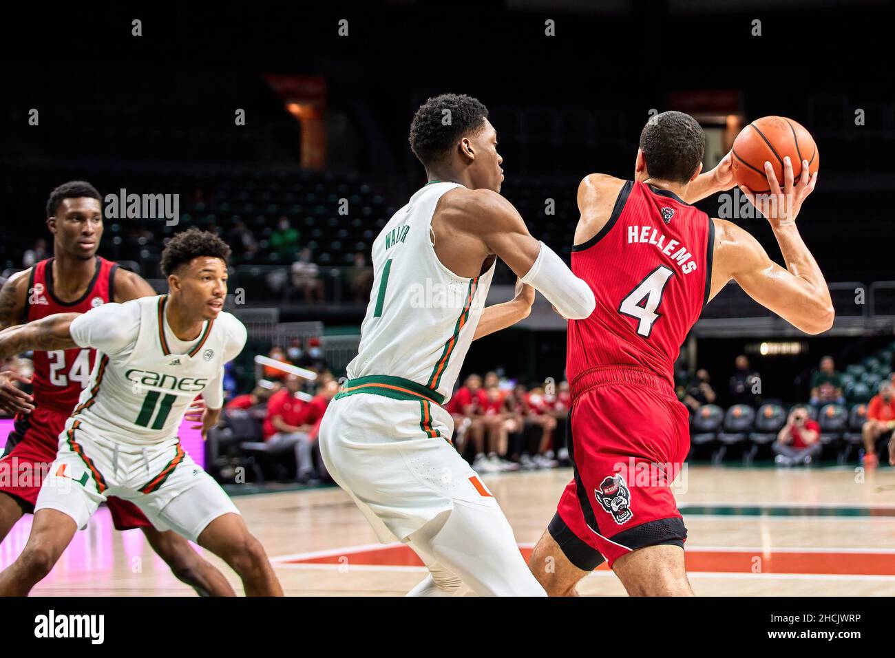 Coral Gables, Florida, USA. 29th Dec. 2021. 4 Jericole Hellems  during the Men’s Basketball between Miami Hurricanes vs NC State in Watsco Center. Credit: Yaroslav Sabitov/YES Market Media/Alamy Live News Stock Photo