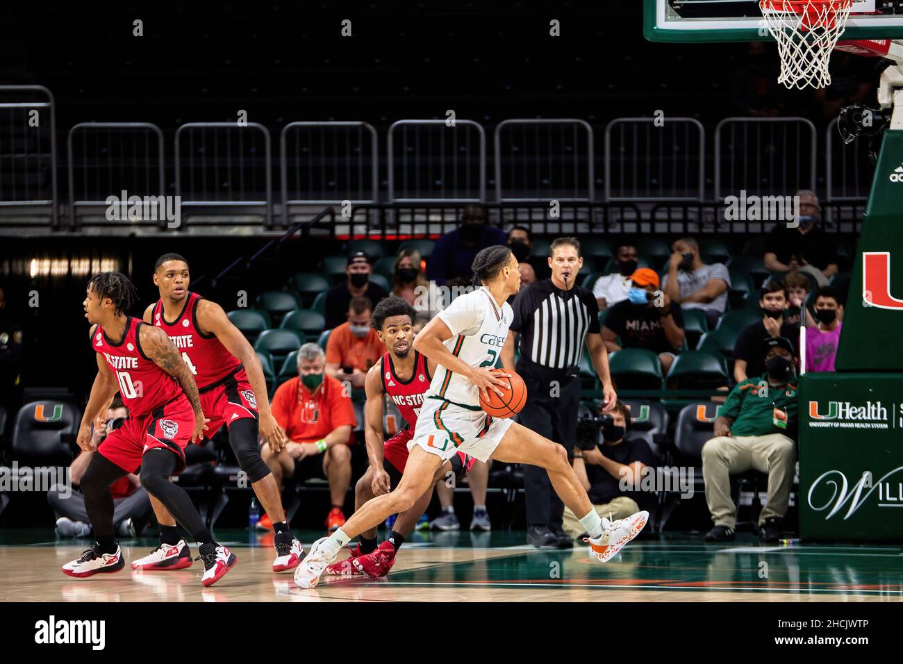 Coral Gables, Florida, USA. 29th Dec. 2021.  2 Isaiah Wong Guard during the Men’s Basketball between Miami Hurricanes vs NC State in Watsco Center. Credit: Yaroslav Sabitov/YES Market Media/Alamy Live News Stock Photo