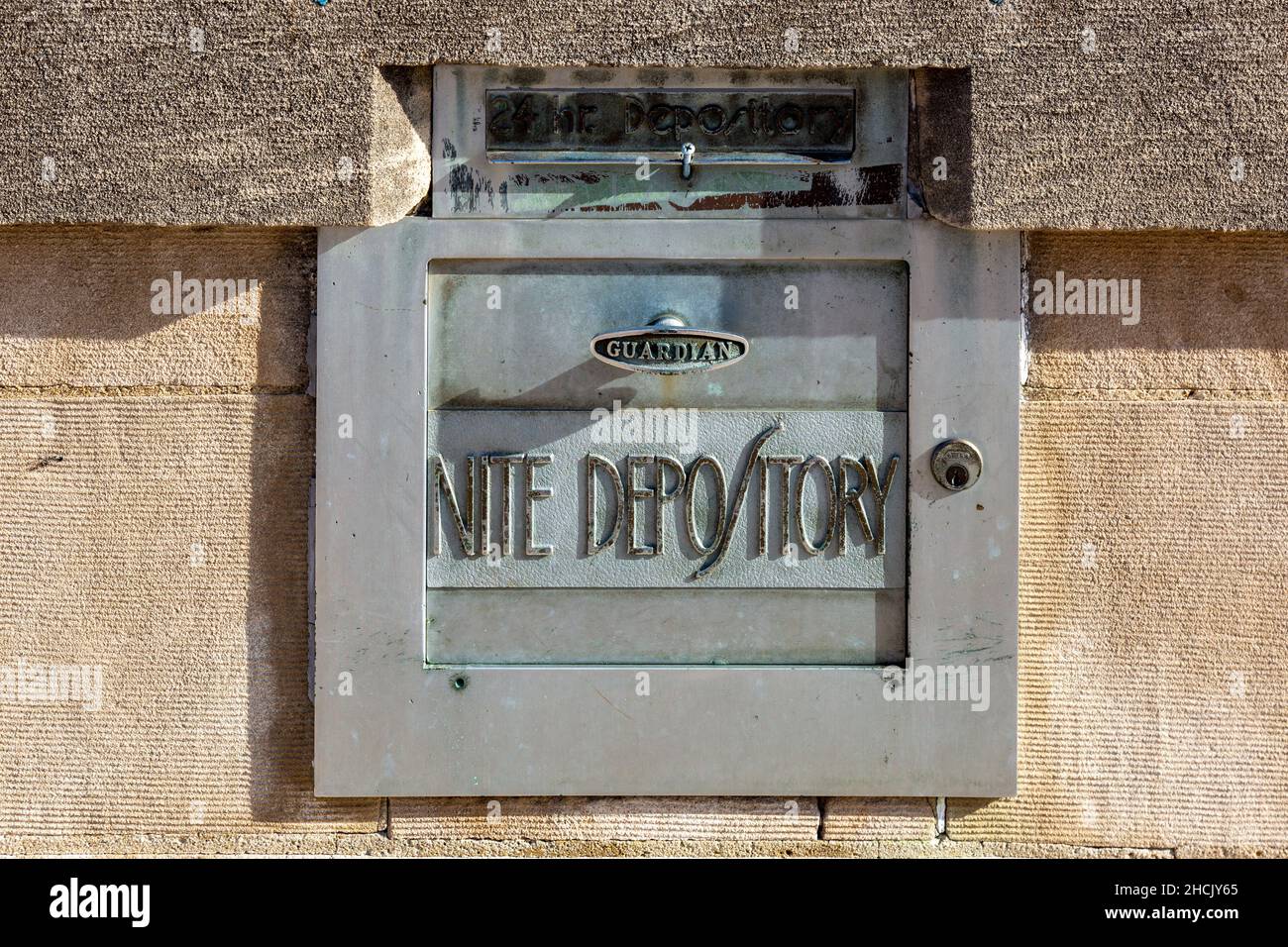 The Guardian night (nite) depository is set in the limestone at the former Studabaker Bank building in Bluffton, Indiana, USA. Stock Photo