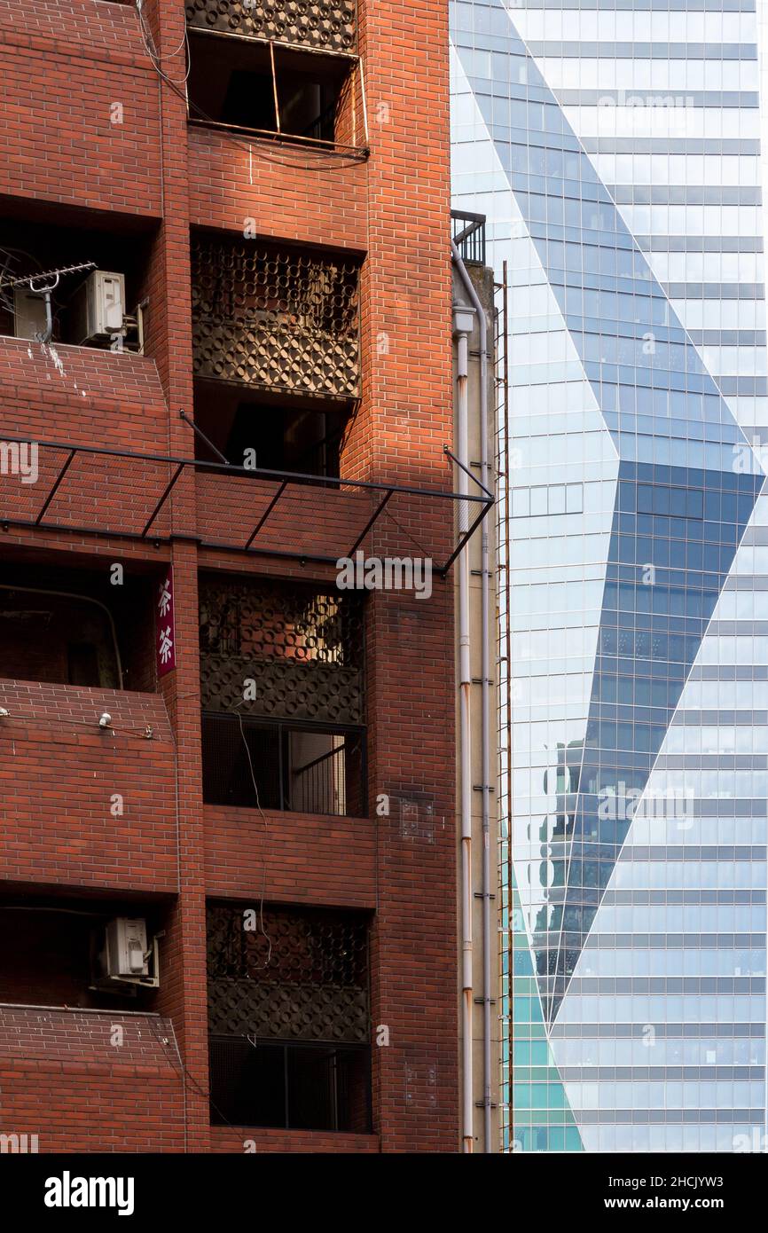 The glass facade of the Sumitomo Fudosan Roppongi Grand Tower behind a