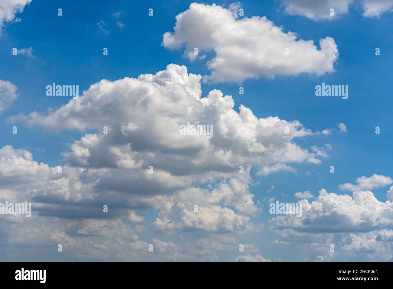 Cumulus clouds far blue daylight sky as natural background Stock Photo ...