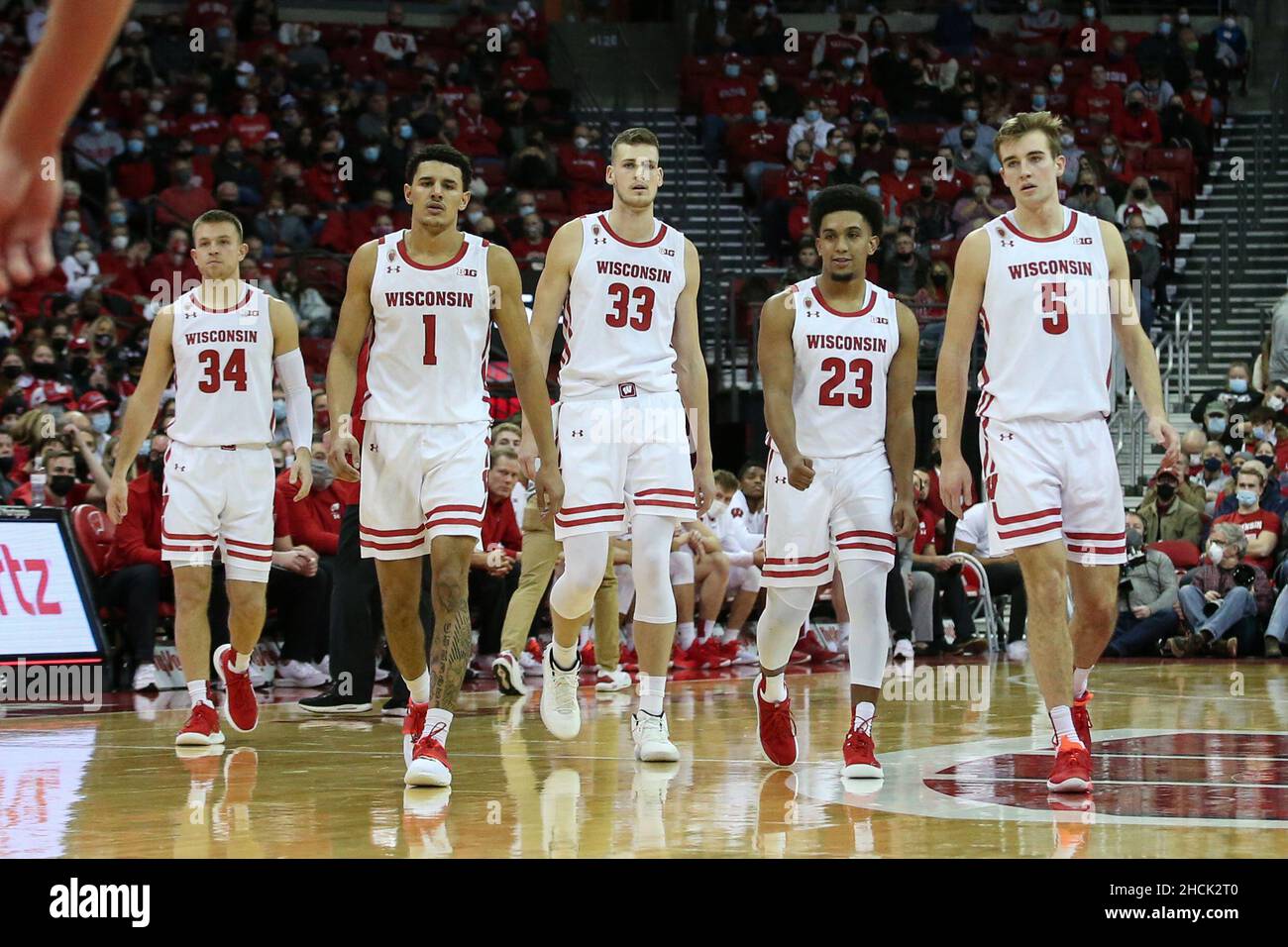 Madison, WI, USA. 29th Dec, 2021. Wisconsin Badgers guard Johnny Davis (1), guard Brad Davison (34), center Chris Vogt (33), guard Chucky Hepburn (23), and forward Tyler Wahl (5) during the NCAA Basketball game between the Illinois State Redbirds and the Wisconsin Badgers at the Kohl Center in Madison, WI. Darren Lee/CSM/Alamy Live News Stock Photo