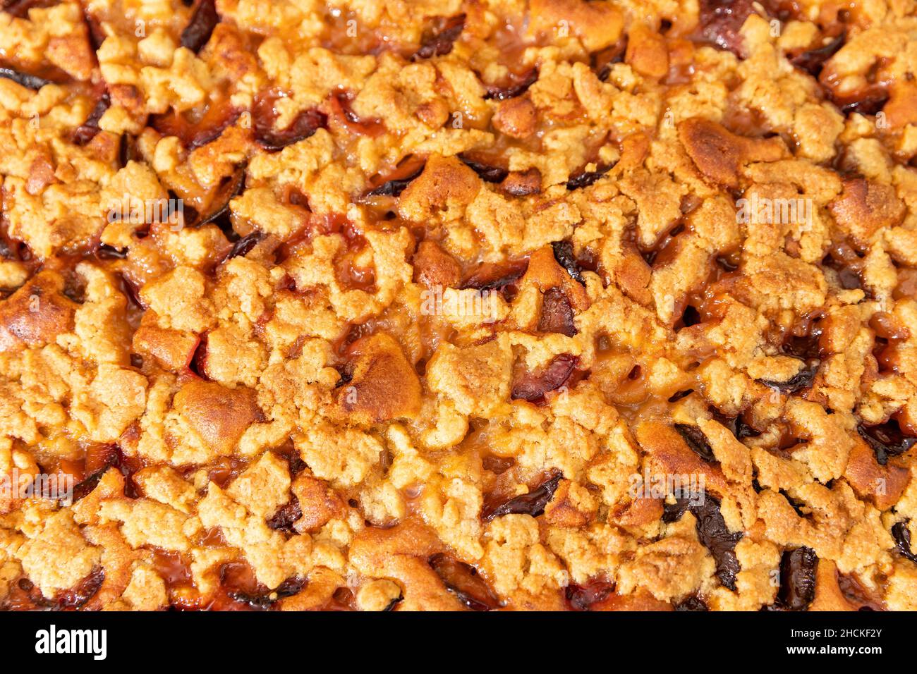 Baking plum cake in the kitchen Stock Photo