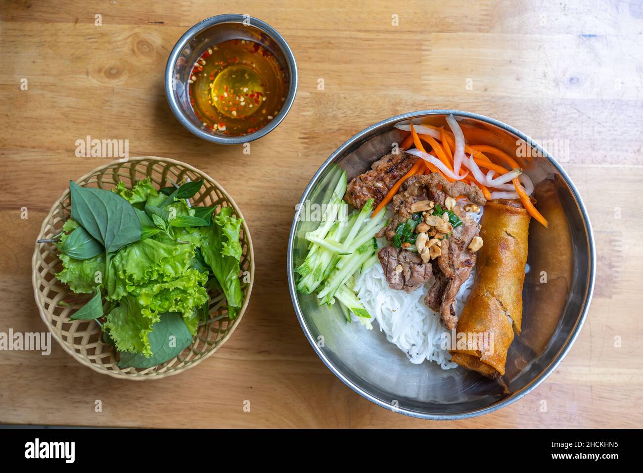 Popular and famous Vietnamese food with rice noodles, grill pork and vegetable Stock Photo