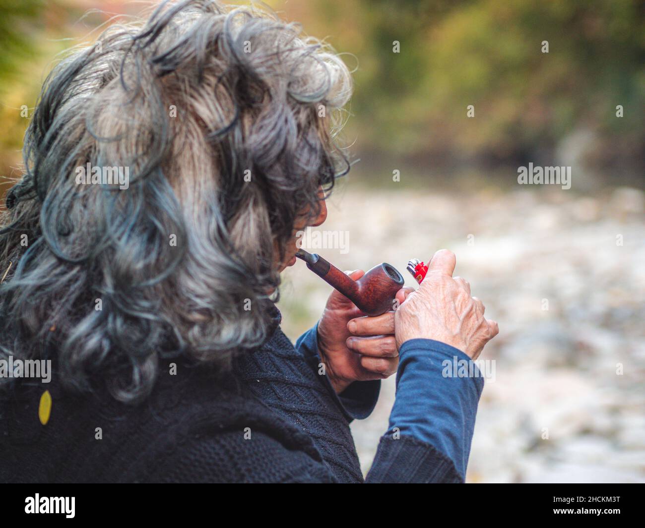 Senior lady with gray hair smoking a pipe Stock Photo - Alamy Senior lady with gray hair smoking a pipe Stock Photo - Alamy