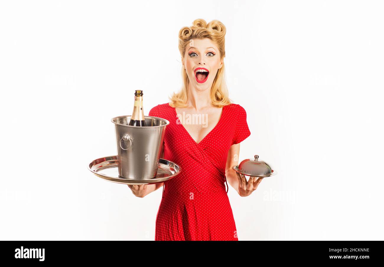 Pinup restaurant waiter with champagne and service tray. Serving presentation concept. Stock Photo