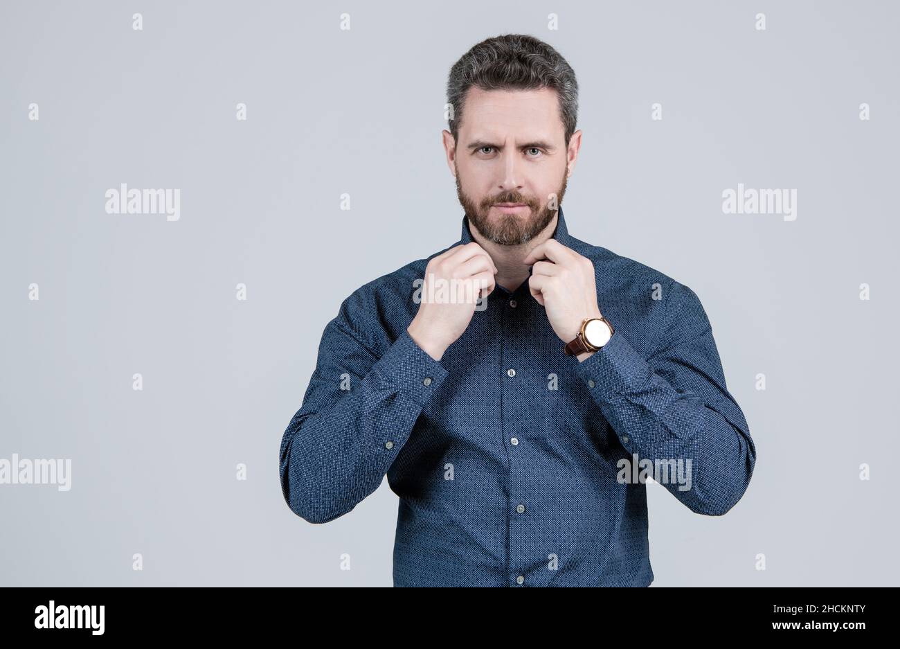 Looking effortlessly smart. Unshaven man button shirt grey background. Wearing smart casual Stock Photo