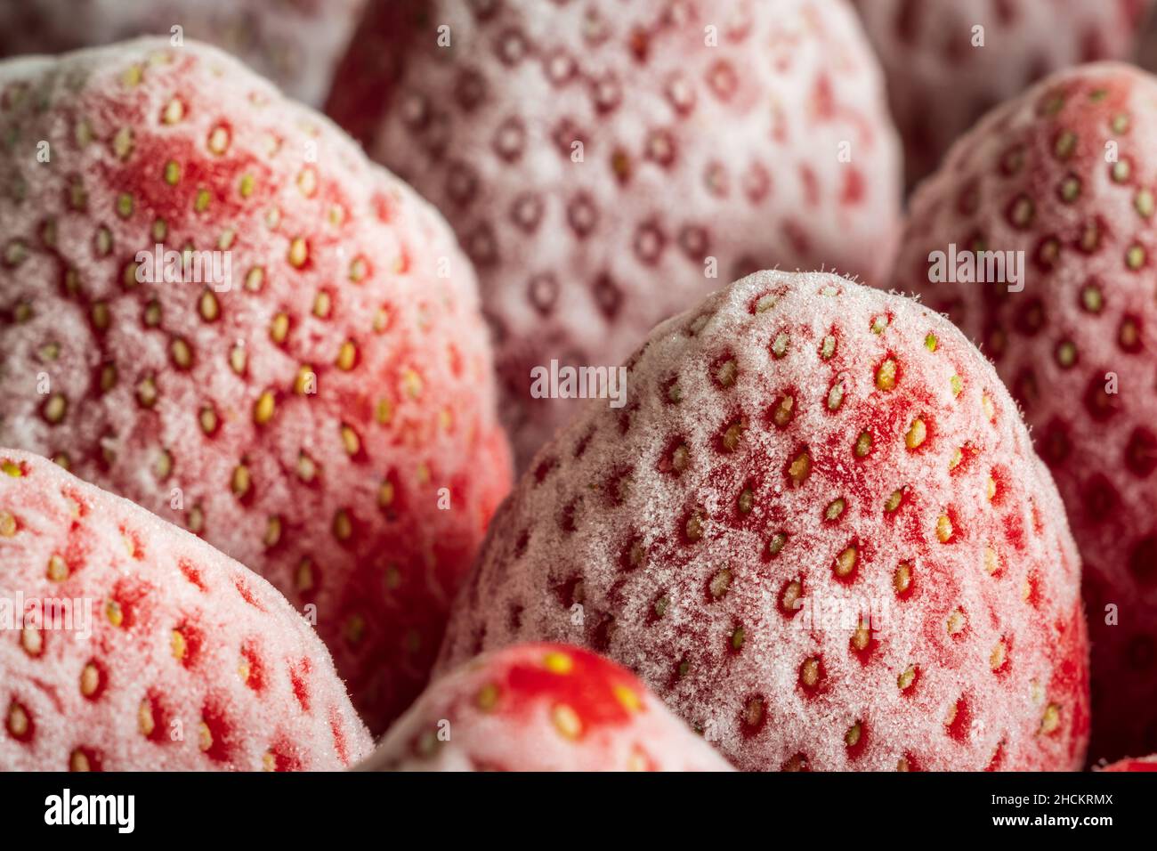 frozen ripe strawberries background closeup Stock Photo - Alamy