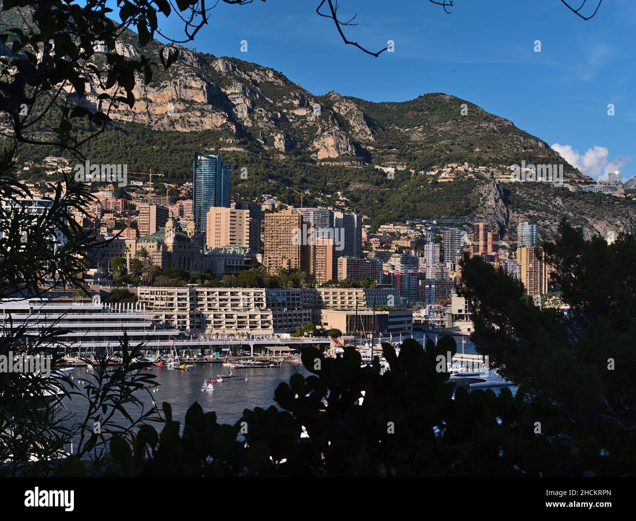 Cityscape of Monaco at the French Riviera with famous casino in district Monte Carlo surrounded by dense development with residential buildings. Stock Photo