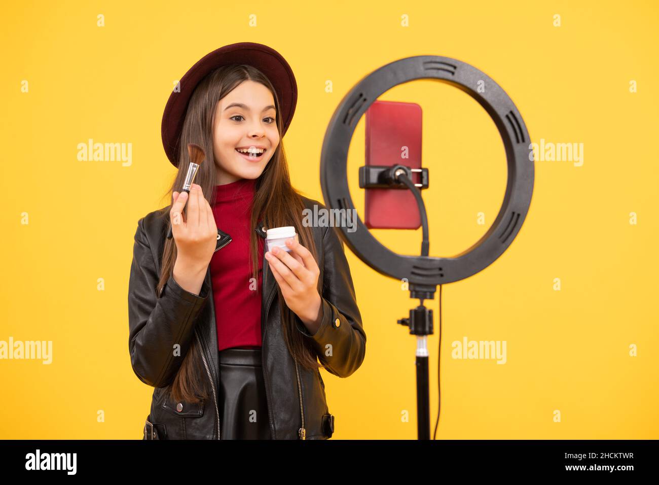 makeup tutorial. influencer. teen girl use selfie led. kid beauty