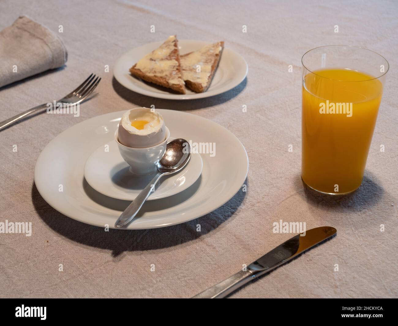 Boiled Egg Breakfast Table with a Glass of Orange Juice and Buttered ...