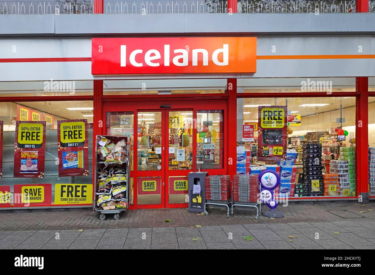 Close up Iceland Supermarket high street shop front window & entrance doors to frozen food grocery business in retail store premises Essex England UK Stock Photo
