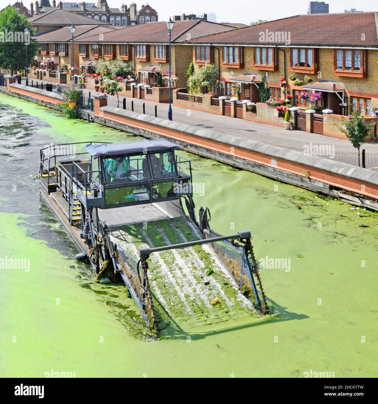 'The Lee mean alga clean machine' owned by British Waterways at work on the Lee Navigation cleaning up green hot summer algal bloom Hackney London UK Stock Photo