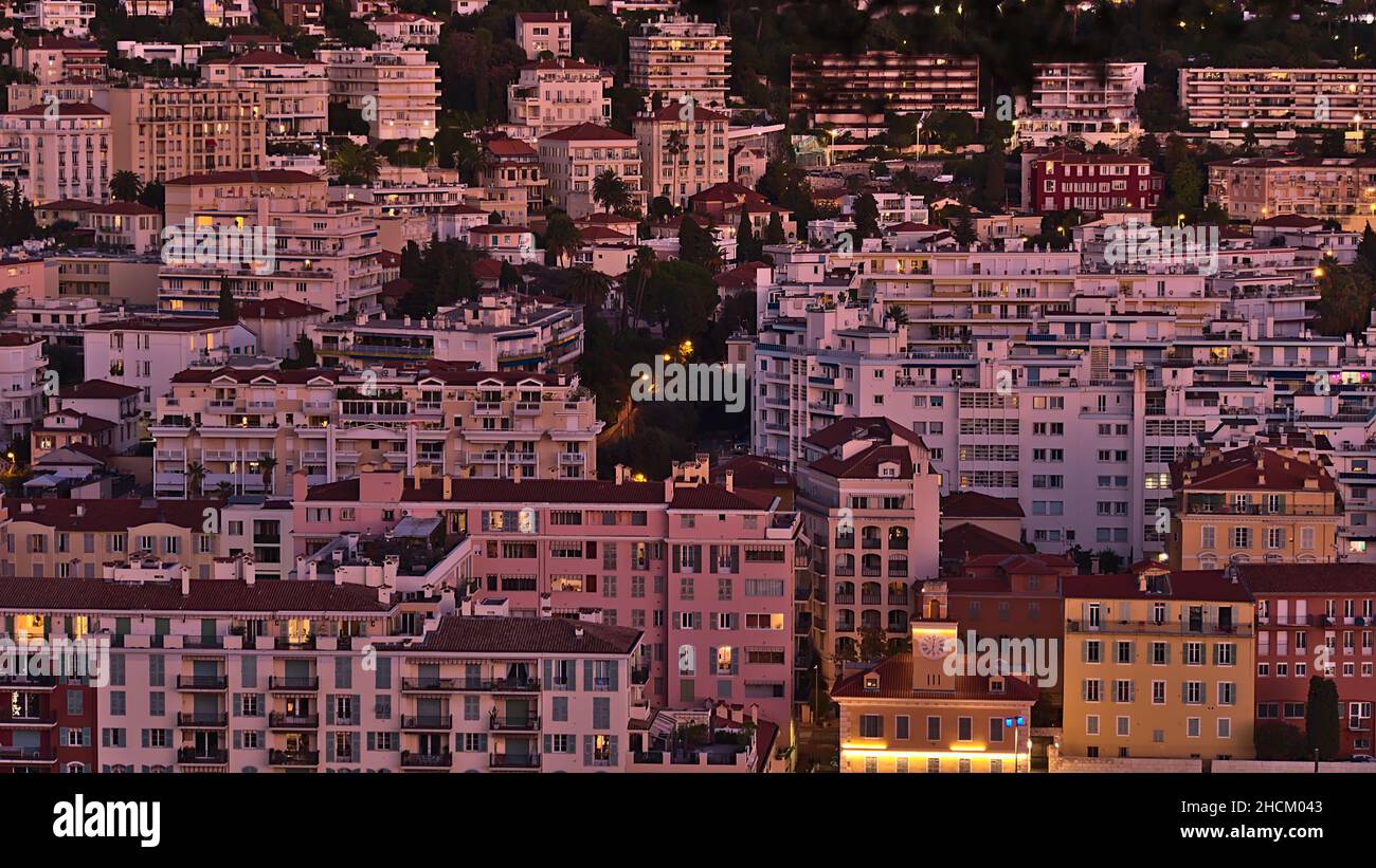 Beautiful aerial view over district Quartier du Port in the downtown of Nice, France at the French Riviera in the evening light after sunset. Stock Photo