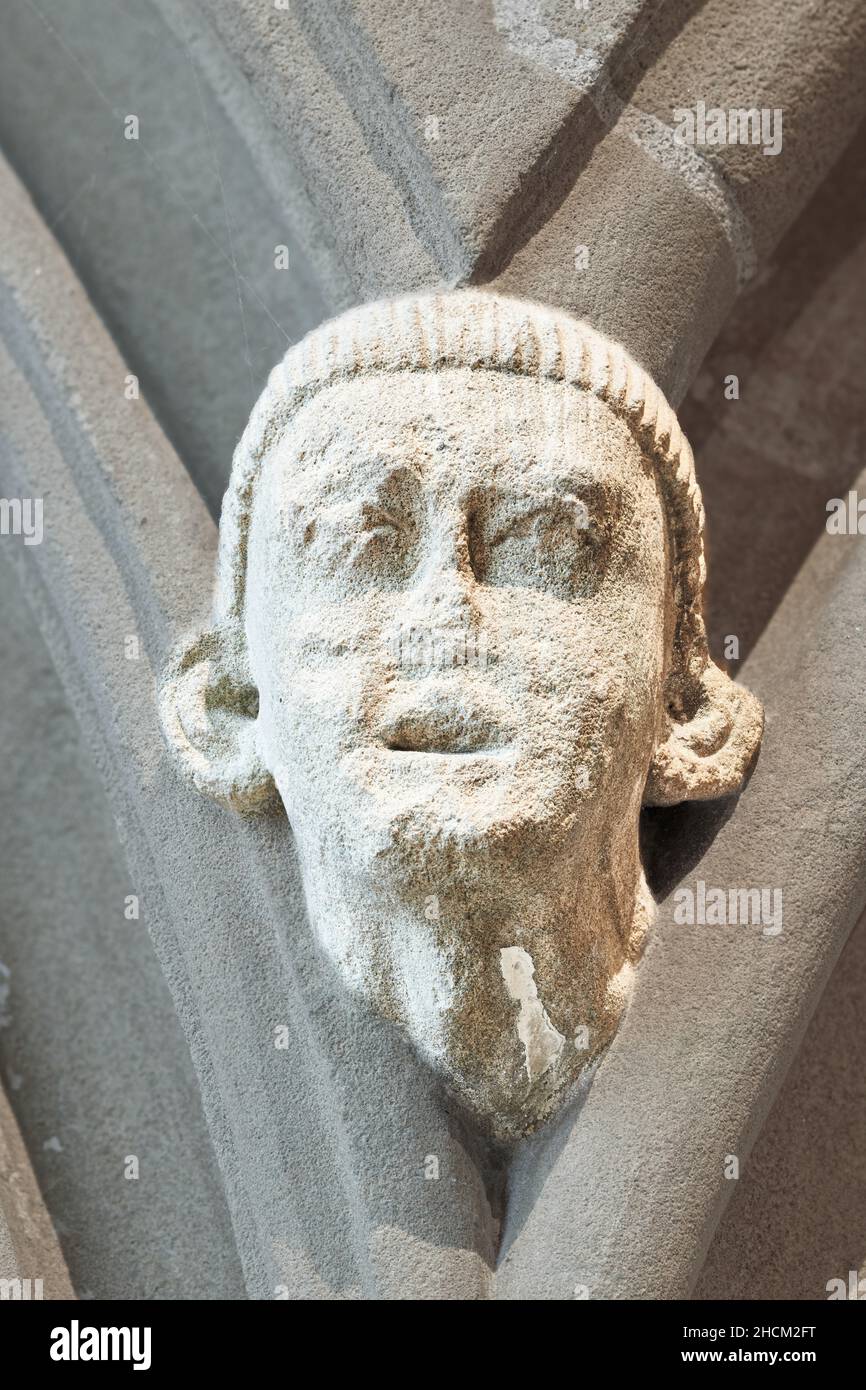 Medieval sculpture of a male head, on a wall of the chapter house at
