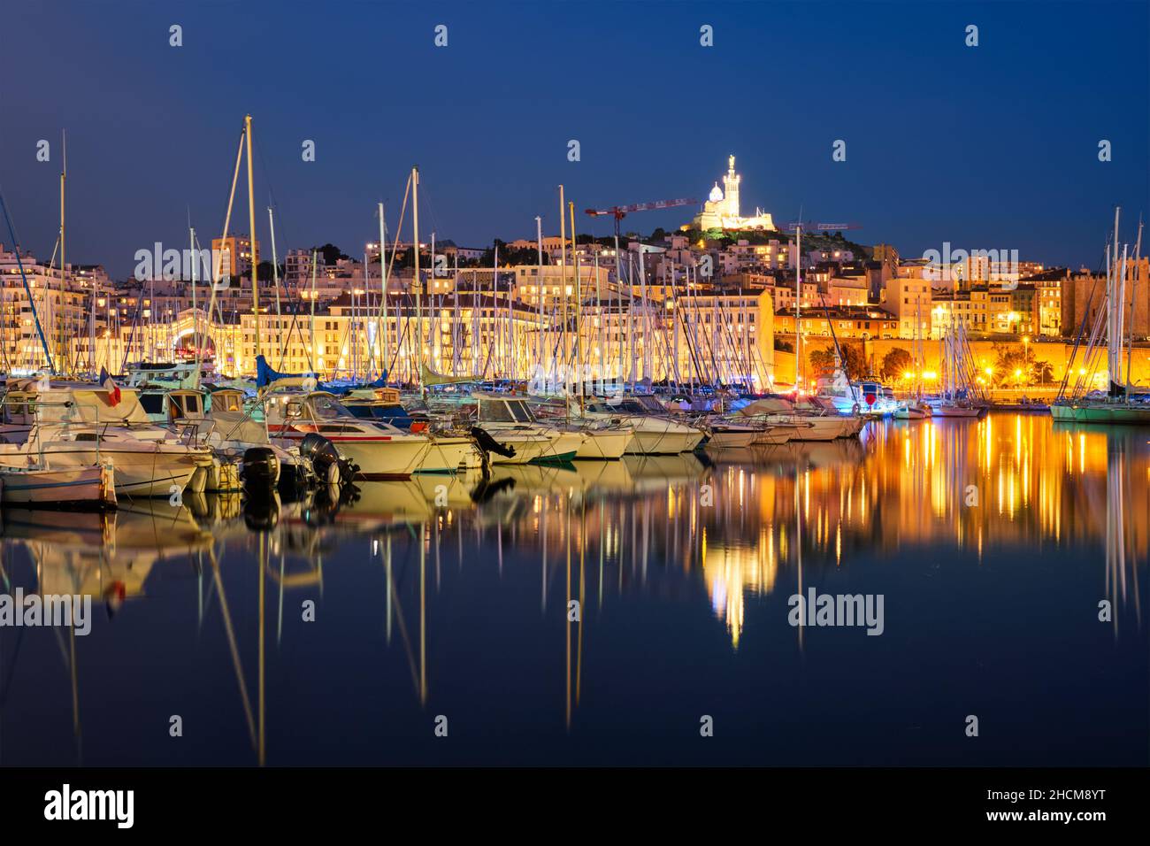 Vieux port and notre dame de la garde by night hi-res stock photography ...