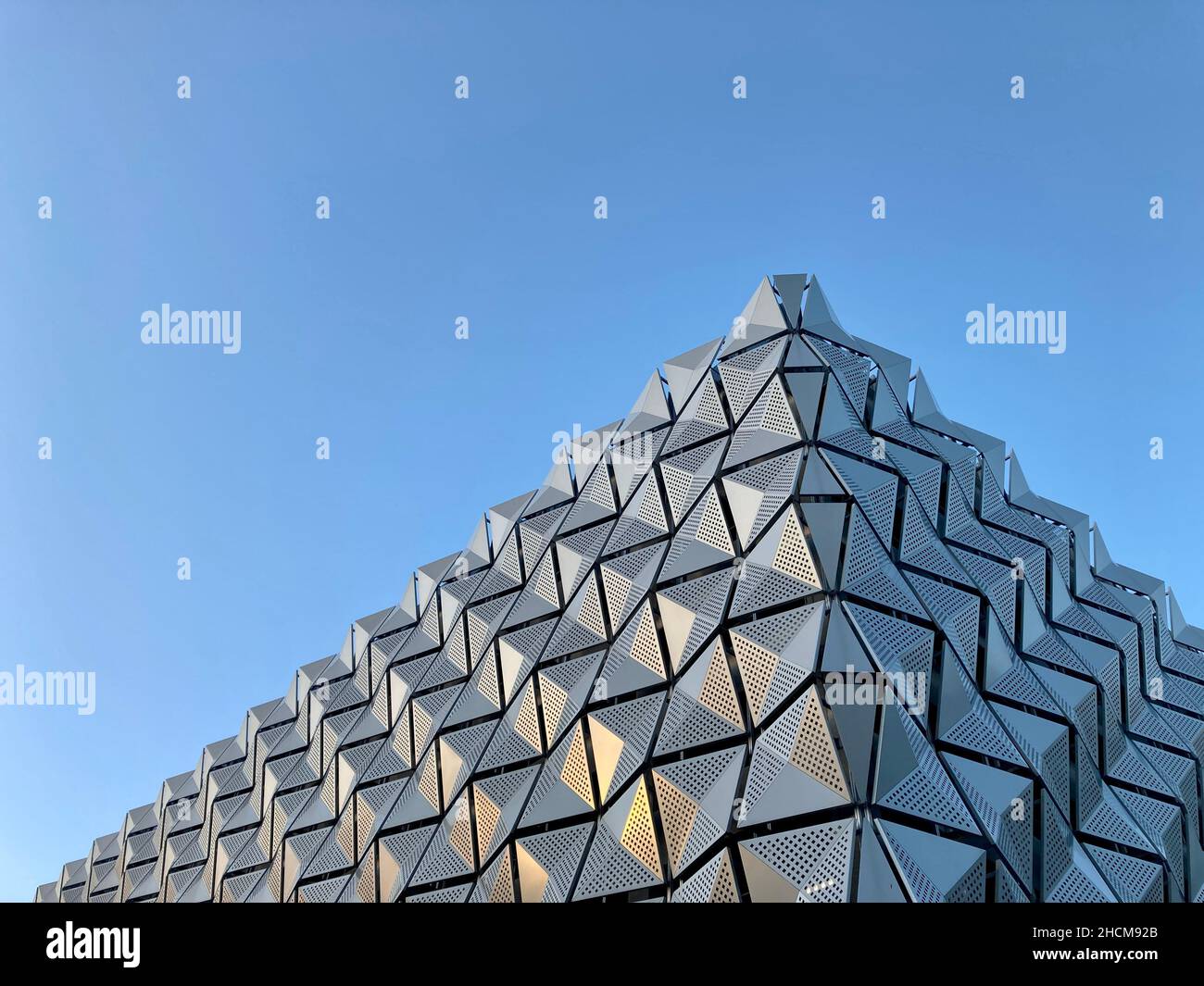 Multi storey car park at University of Leeds. Kirkstone perforated metal mesh panel facade cladding. Architect Carey Jones & Construction Wates Group Stock Photo