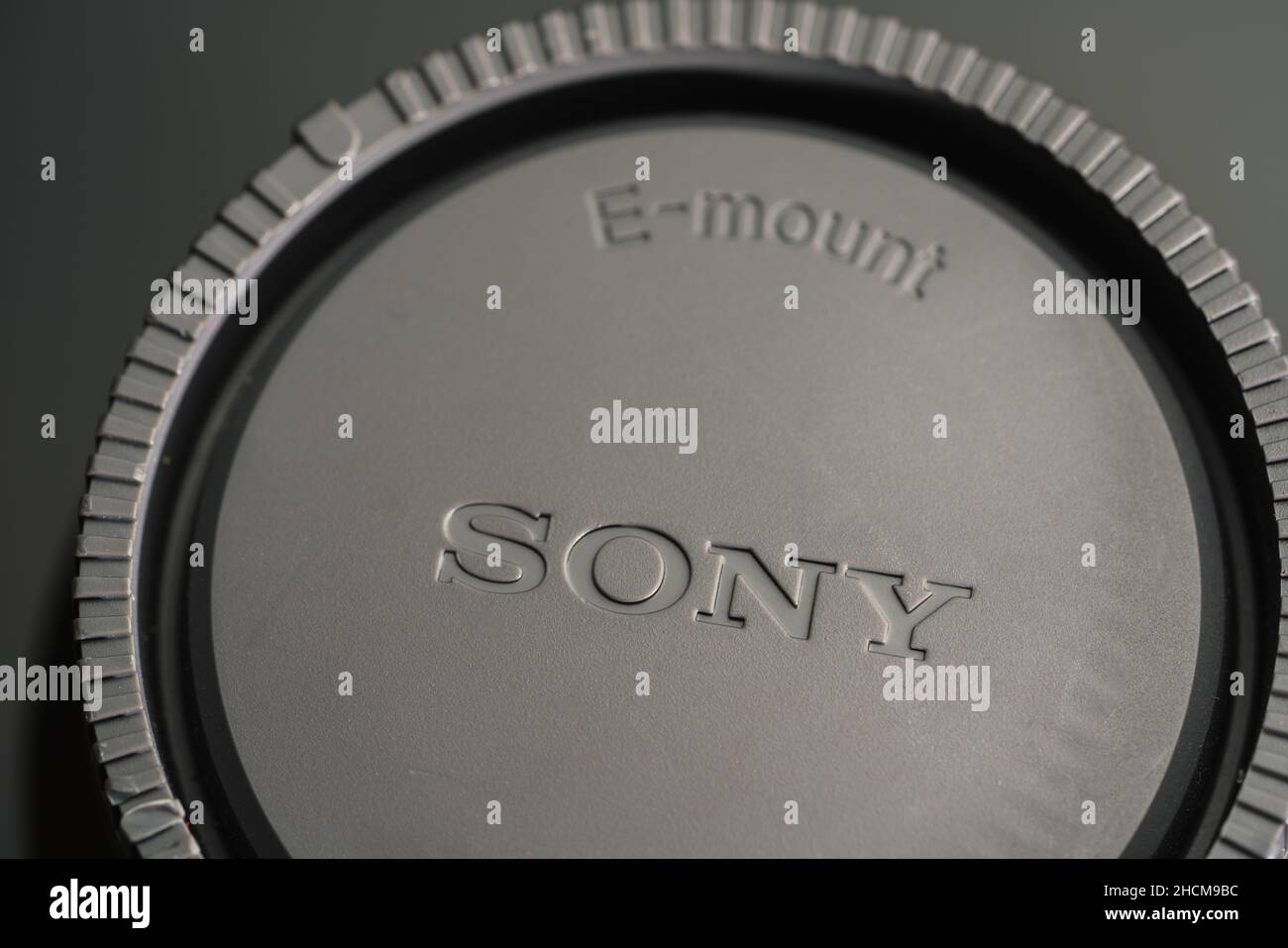 Sony logo on a lens cap. Sony is a Japanese multinational company that manufactures electronic products. Its headquarters are in Tokyo, Japan. Stock Photo