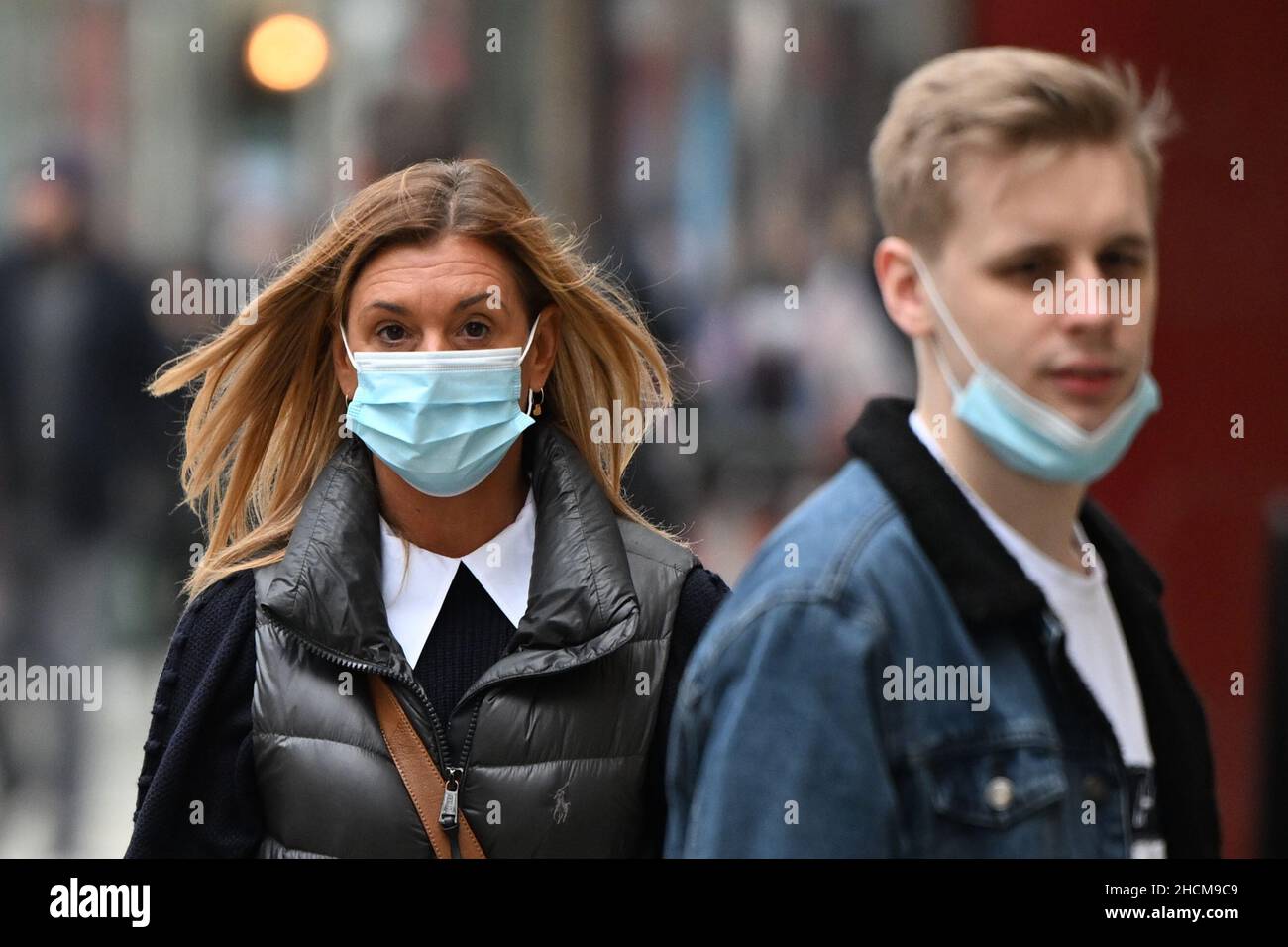 CARDIFF, WALES - DECEMBER 29: Shoppers wear face masks in the City ...