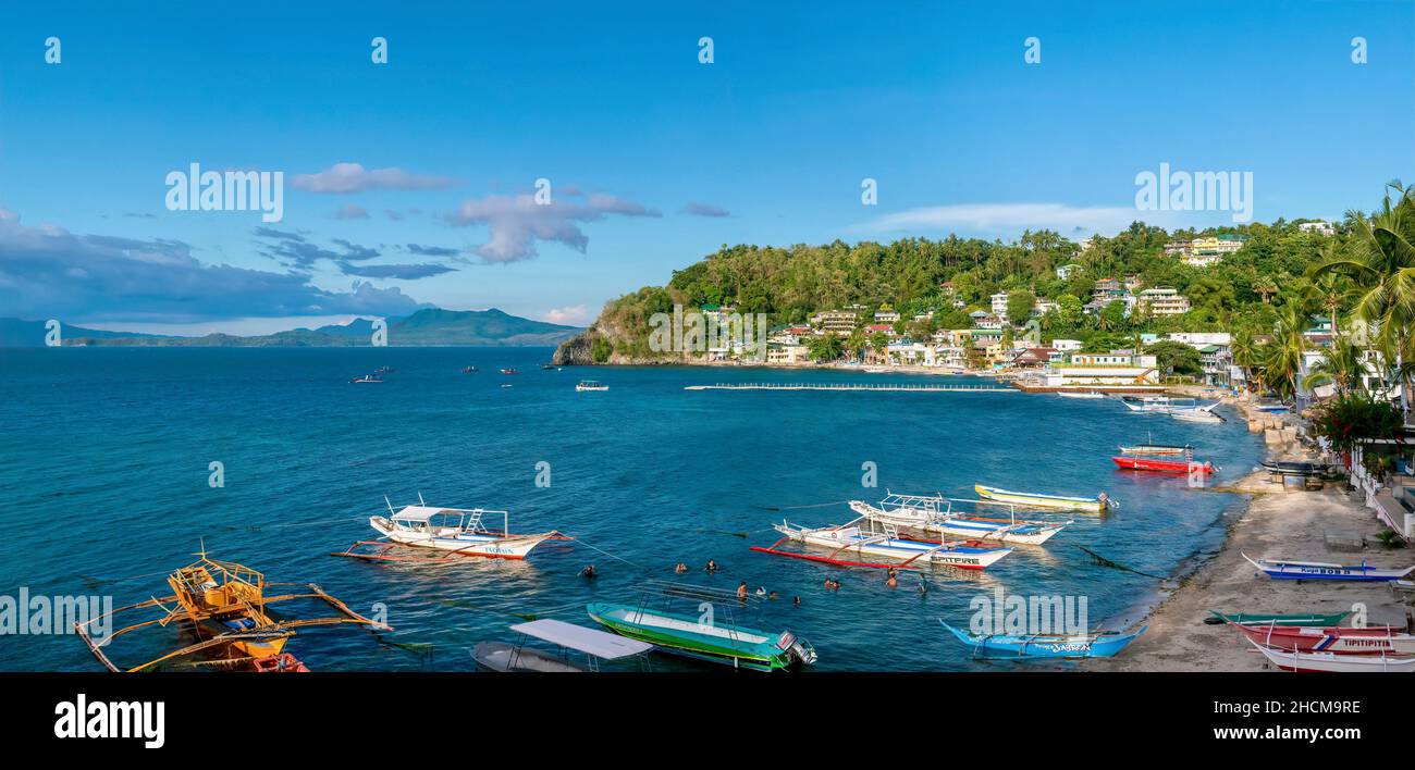 Puerto Galera, Philippines - May 22, 2021. Panoramic view of Sabang Beach, a popular diving destination and resort in Oriental Mindoro, Mindoro Island Stock Photo
