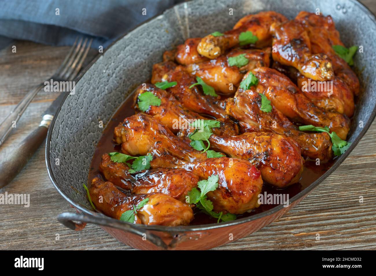 Spicy roasted chicken drumstick marinated with chili sauce and honey