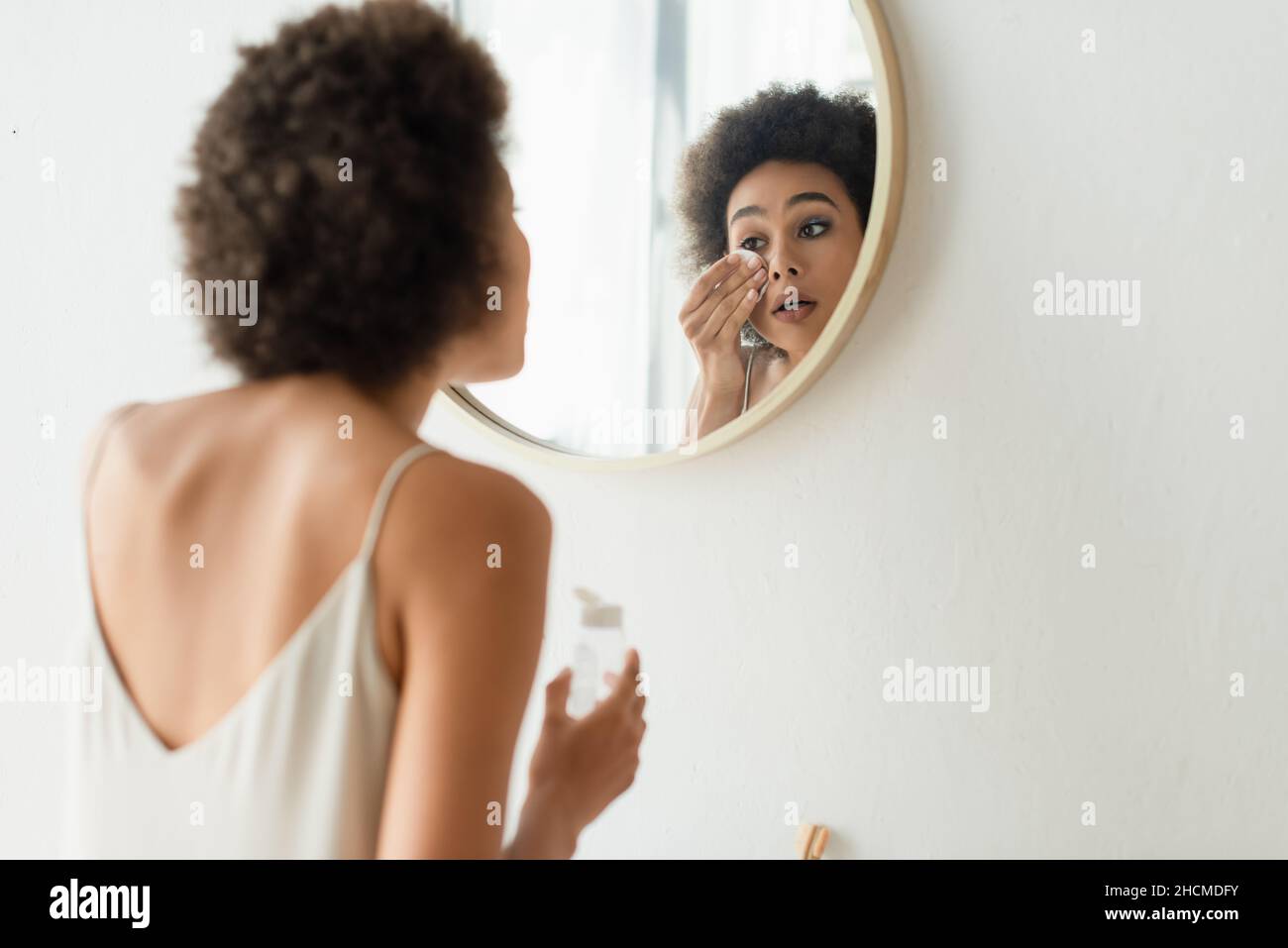 Black woman cleaning face hi-res stock photography and images - Alamy