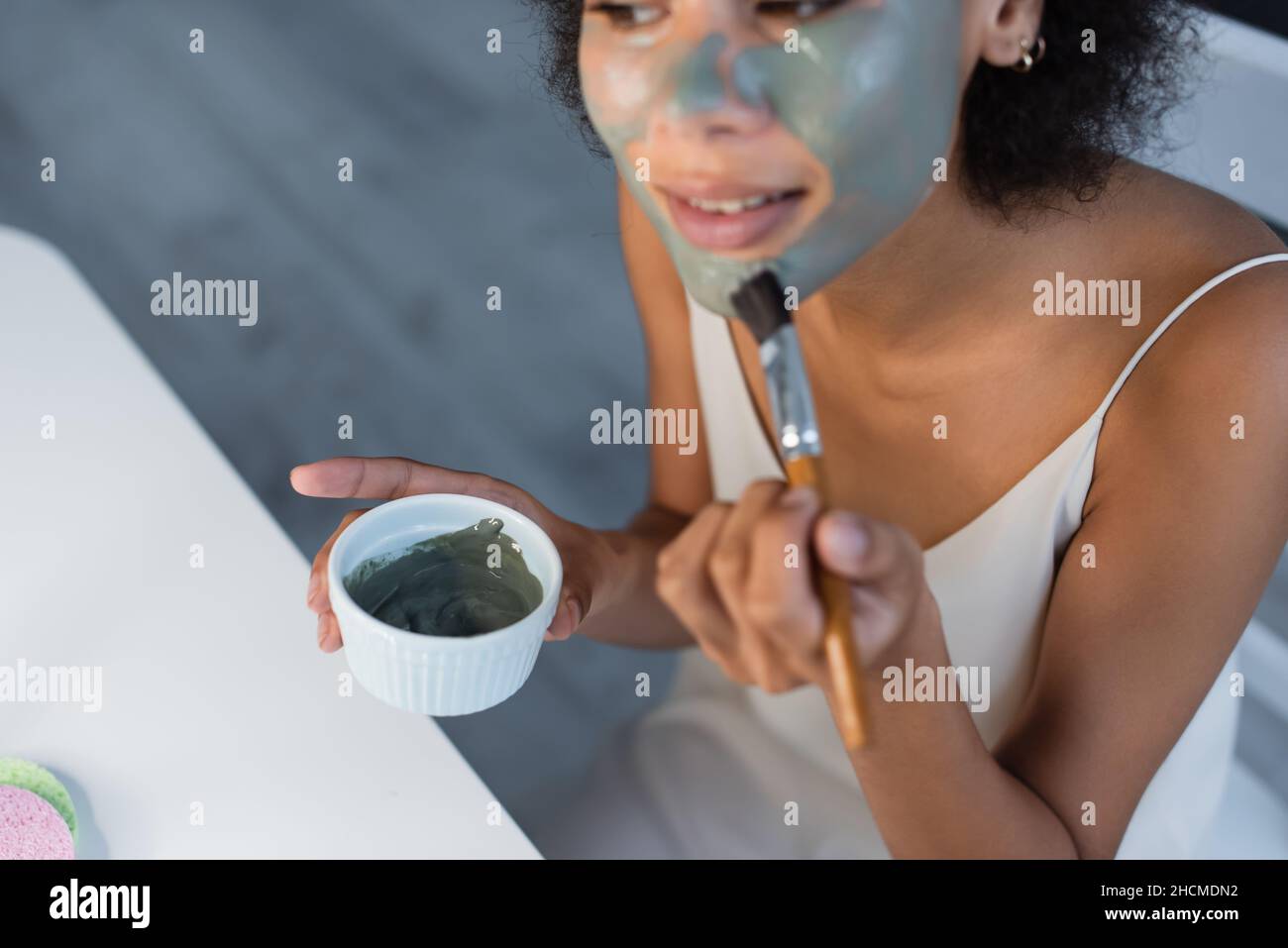 Black woman applying beauty mask hi-res stock photography and images ...