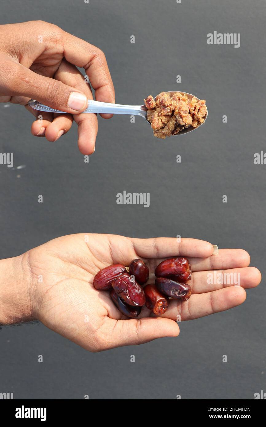 dates and jaggery with hend Stock Photo